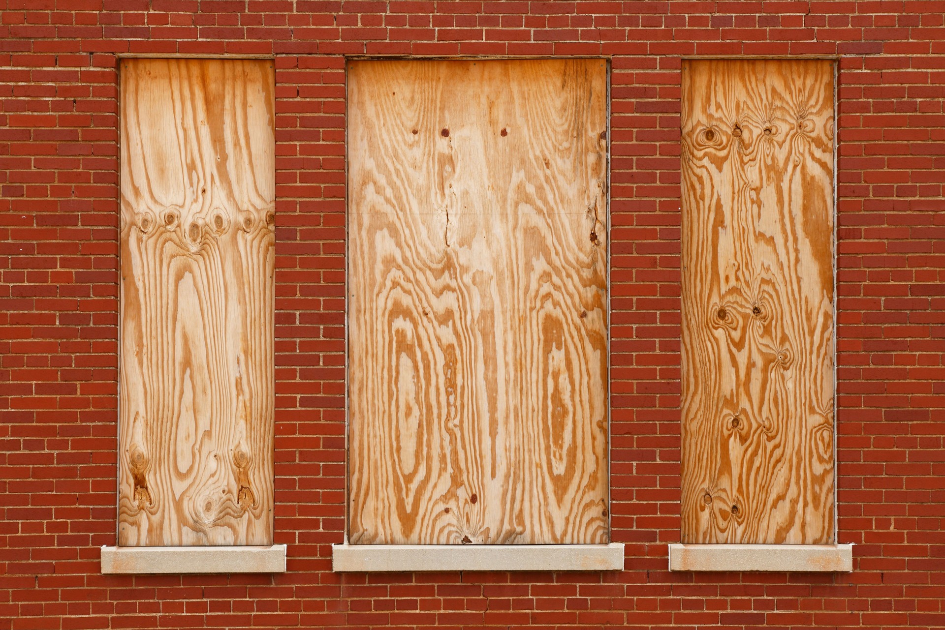 Boarded windows in abandoned building